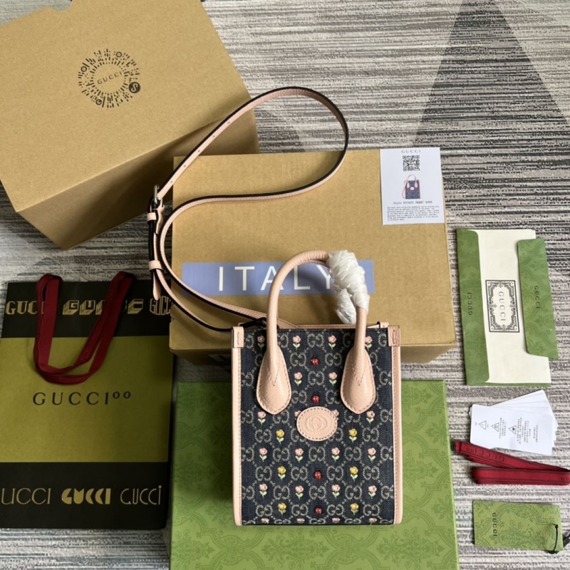 G*u*i top handle bags